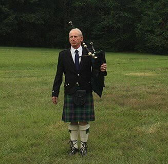 Brian Widelitz – Solo Bagpipe Competitor and Instructor Close-up of Brian Widelitz holding a bagpipe